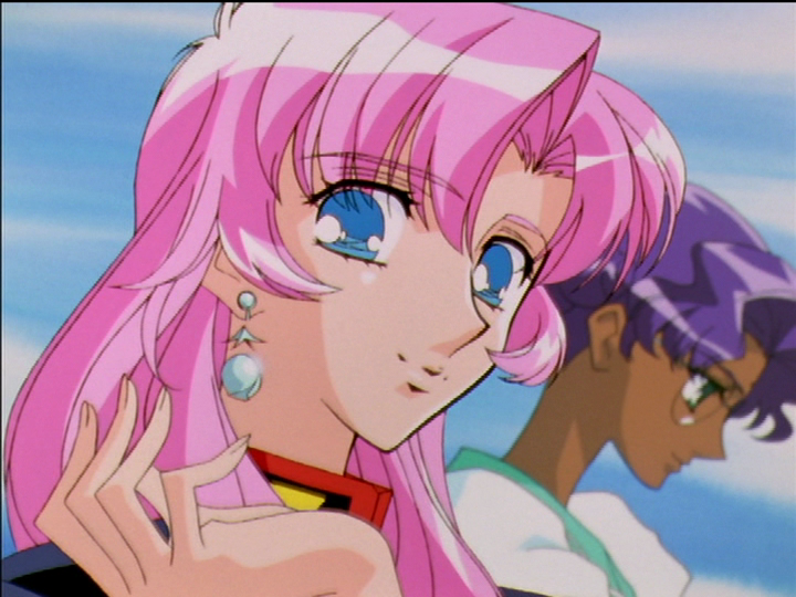 The earring on Utena’s ear, with Anthy in the background.